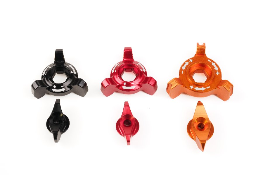 Anodized adjusters for spring preload in black, red and orange