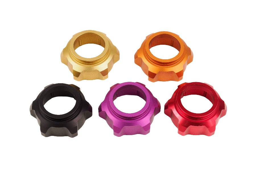 Anodized fork caps in gold, orange, black, pink and red